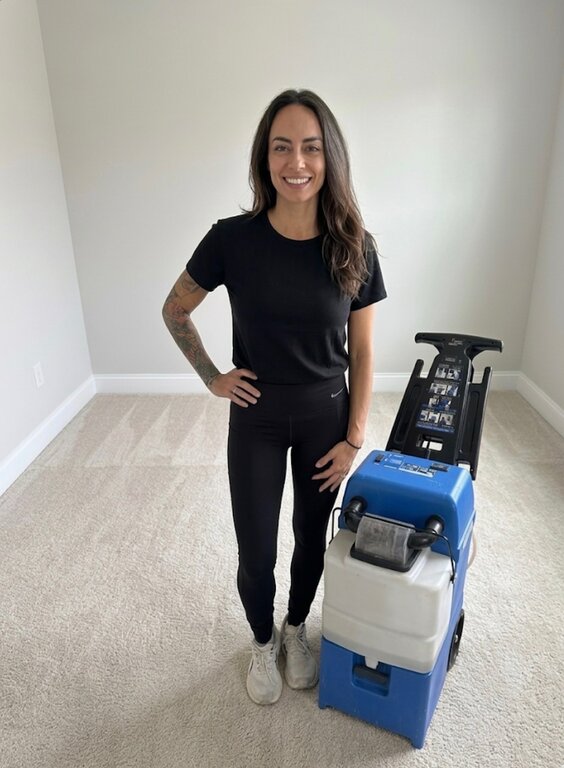 Heather Swanson with her carpet cleaning equipment